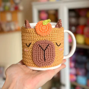 Enfeite de caneca Capilhosa, a capivara maravilhosa